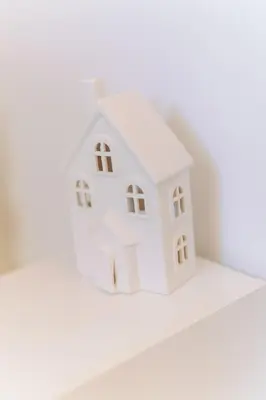 a white model of a house on a shelf at Roma Centro Holiday House in Rome
