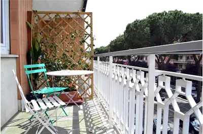 a patio with a table and chairs on a balcony at Gregory Place in Rome