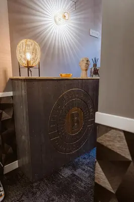 a table with a sign on it with a chair at Bello Urban Boutique - Golden Keys Collection in Rome