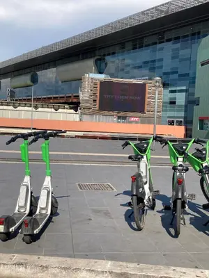 two scooters are parked in front of a building at Domus Provinciae in Rome