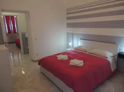 a bedroom with a large bed with two pillows on it at Apt Central Magenta in Rome