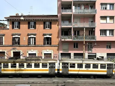 a train is parked in front of a building at Camilla Charme in Rome