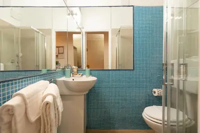a bathroom with a sink and a toilet and a shower at Domus Romana Musei Vaticani in Rome