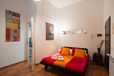 a bedroom with a colorful bed in a room at Cozy apartment in Esquilino in Rome