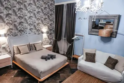 a living room with a couch and two chairs at loft a Castel S Angelo A e B in Rome