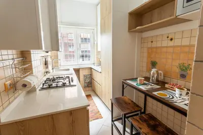 a kitchen with a sink and a stove top oven at 