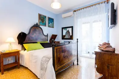 a bedroom with a large bed and a window at B&B all'ombra del Vaticano in Rome