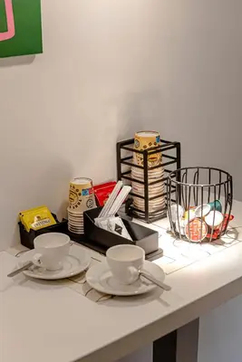 two cups and saucers sitting on a table at 24VaticanSuite in Rome