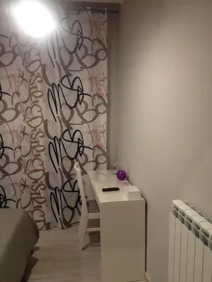 a room with a table and a wall with a wall at Bbrothershouse in Rome