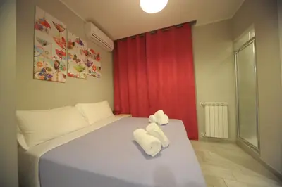 a bedroom with a bed with towels on it at Bbrothershouse in Rome