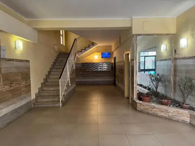 an empty hallway with stairs in a building at Apt with balcony in Roman Quiet in Rome