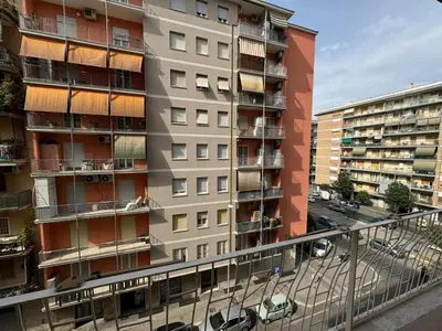 an apartment building with balconies and a street at Apt with balcony in Roman Quiet in Rome