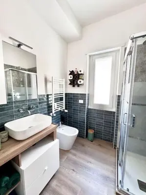 a bathroom with a sink and a toilet and a shower at La Casa di Casa - il tuo posto speciale in Rome