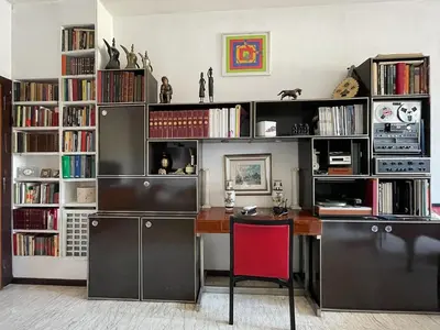 a home office with a desk and book shelves at Casa di Alfredo -Appartamento Musei Vaticani in Rome