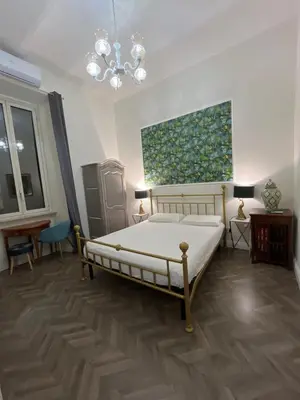 a plate and a fork on a table at Tiburtino Apartment in Rome