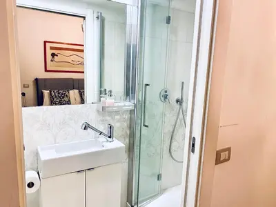 a bathroom with a sink and a shower at Cozy Flat near the Vatican! in Rome