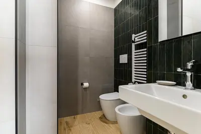 a bathroom with a sink and a toilet at Del Frate Guest House Vatican in Rome