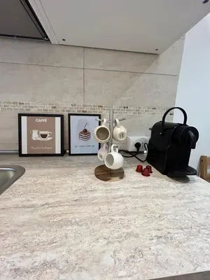 a bathroom with a sink and a lamp and a bag at Casa Domus Mea - garden addicted in Rome
