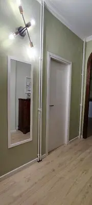 an empty room with a ceiling fan and a door at Charming Apartment 367 in Rome