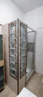 a bathroom with a shower and a walk in closet at Charming Apartment 367 in Rome