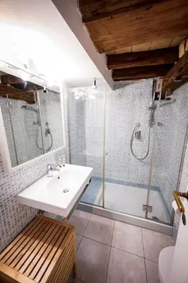 a bathroom with a sink and a shower and a tub at Pantheon Appartamento Costaguti in Rome