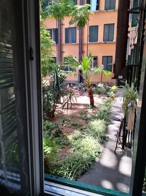 a window view of a garden outside a building at Notti di San Lorenzo in Rome