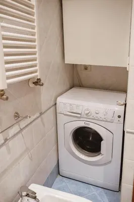 a washer and dryer in a small bathroom at Two Bedroom Appartment - 3 min Metro Conca D'Oro by ORPI RENT in Rome