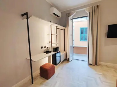a living room with a room with a balcony at Crystal Domus in Rome