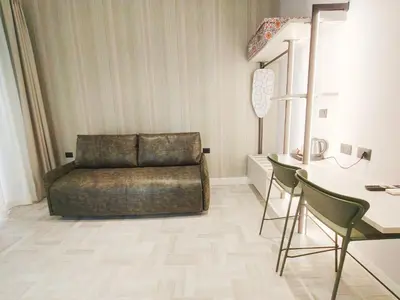 a living room with a couch and a table at Crystal Domus in Rome