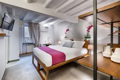 a bedroom with a large bed in a room at The Spanish Suite Piazza di Spagna in Rome