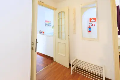 a hallway with a bench next to a door at Vespasiano 49 in Rome