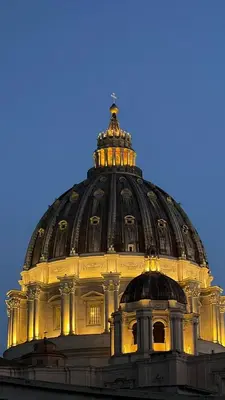 a dome of a building with its lights on at Maison Cavalleggeri in Rome