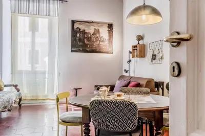 a living room with a table and chairs and a couch at 