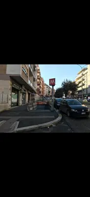 a street with cars parked on a city street at Casa di Flavio a San Pietro in Rome