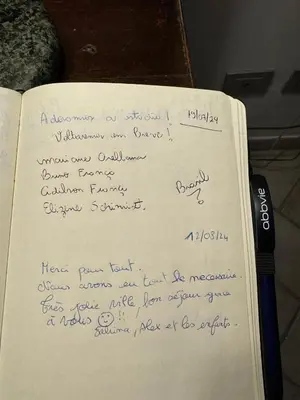 a book with handwriting on it with a pen on it at B&S Suite Colosseo in Rome