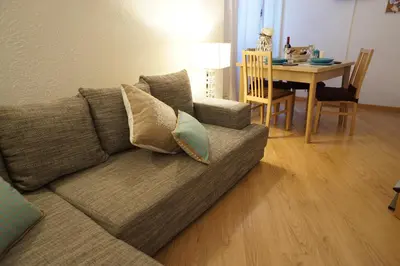 a living room with a couch and a dining room table at B&S Suite Colosseo in Rome