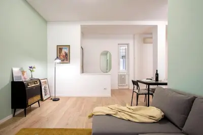 a living room with a couch and a table at Monte Sacro apartment for 6 guests Metro B in Rome