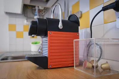 a black and red appliance sitting on top of a counter at ht mama bilo vatican area in Rome