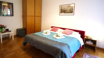 a bedroom with a bed with two dishes on it at Casa Franciska in Rome