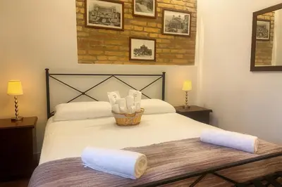 a bedroom with a bed with towels on it at FL Suites - Vatican in Rome