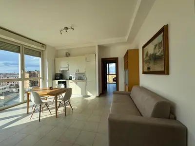 a living room with a couch and a table at Bright apt near Porta Maggiore in Rome
