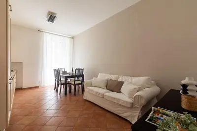 a living room with a couch and a table at Centro - casa a Trastevere in Rome