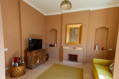 a living room with a television and a fireplace at Boutique Suites Valadier in Rome