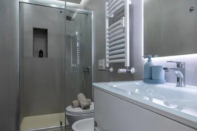 a bathroom with a toilet and a sink and a shower at ToniB&B in Rome