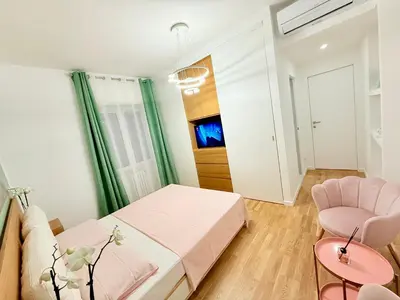 a bedroom with a bed and a couch and a table at ToniB&B in Rome