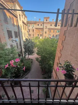 a view of a walkway between two buildings at Rione Testaccio Apartment in Rome