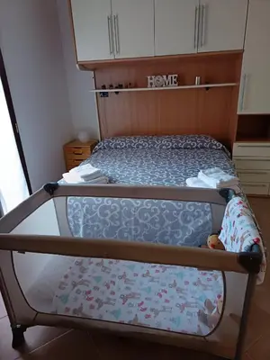 a bed in a room with a bed frame at Rione Testaccio Apartment in Rome