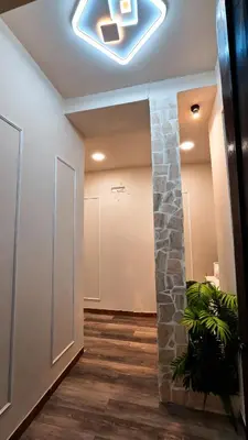 a hallway with a stone wall and a ceiling at Glint House Prestige in Rome
