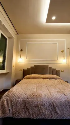 a bedroom with a large bed in a room at Glint House Prestige in Rome