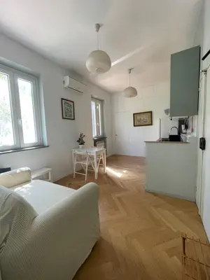 a living room with a couch and a table at Lotto 21 della Garbatella in Rome